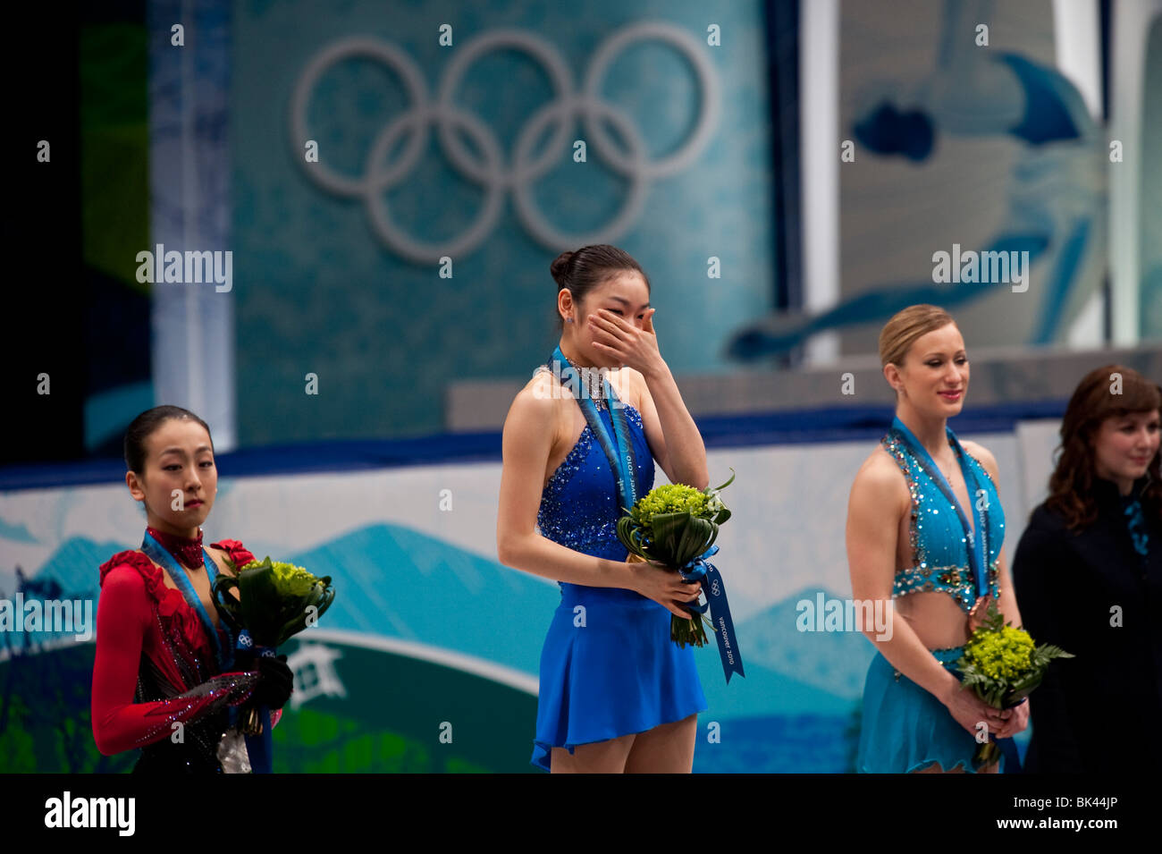 Kim Yu-Na (KOR) gold, Mao Asada (JPN) silver and Joannie Rochette (CAN) bronze receiving their medals for Figure Skating Ladies Stock Photo