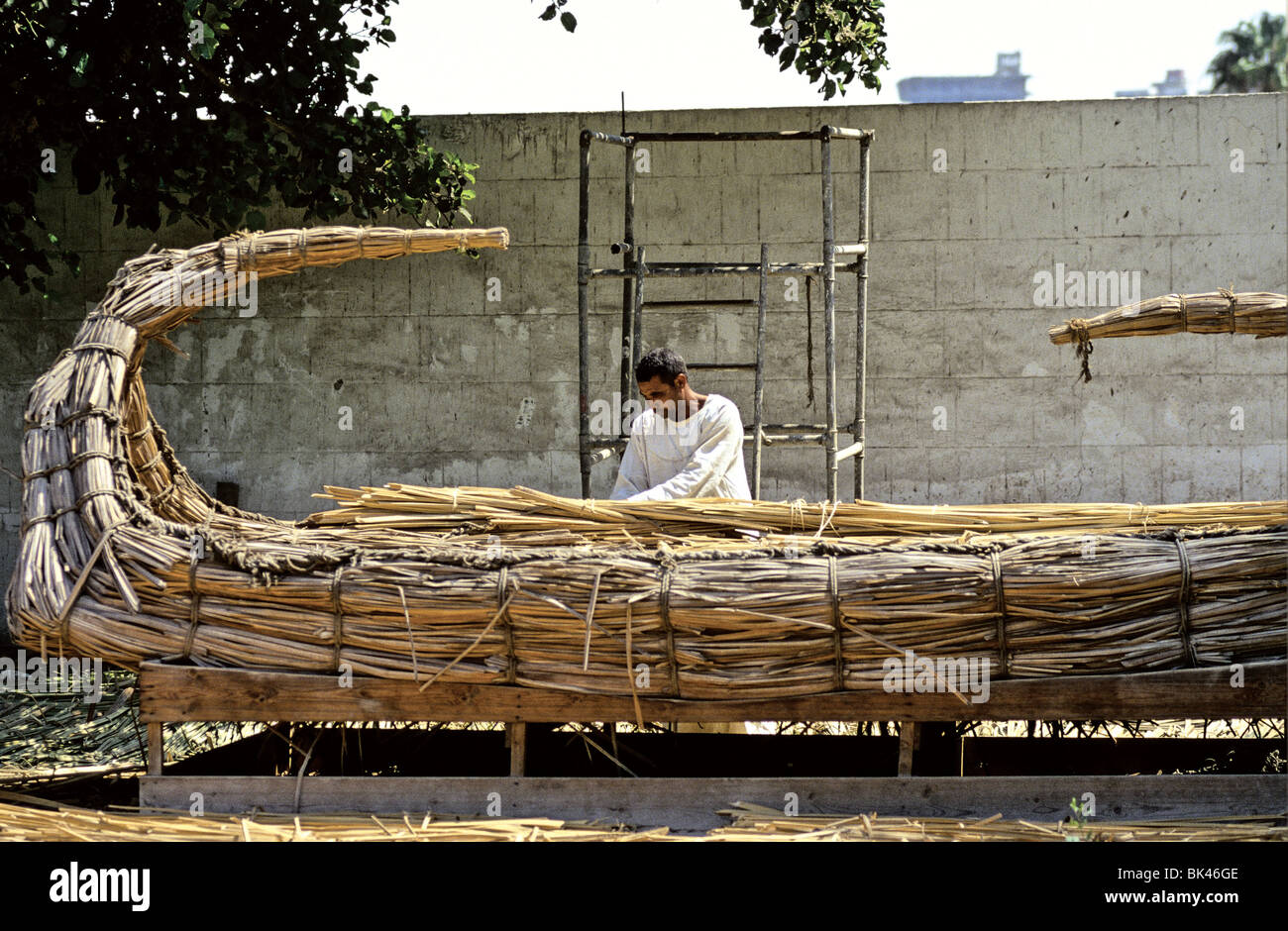 Man building historical reproduction of papyrus reed boat at Dr Ragab's Pharaonic Village (Living History Museum) Cairo Egypt Stock Photo