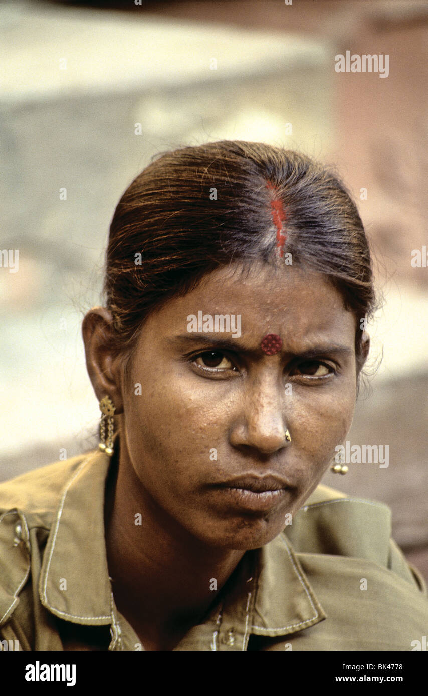 Portrait of a young Indian woman with the traditional ornamental marks of a bindi and sindoor, India Stock Photo