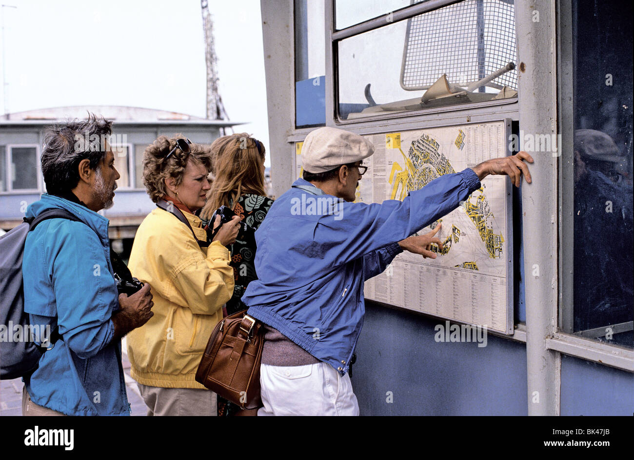 Tourists reading a map, Venice, Italy Stock Photo