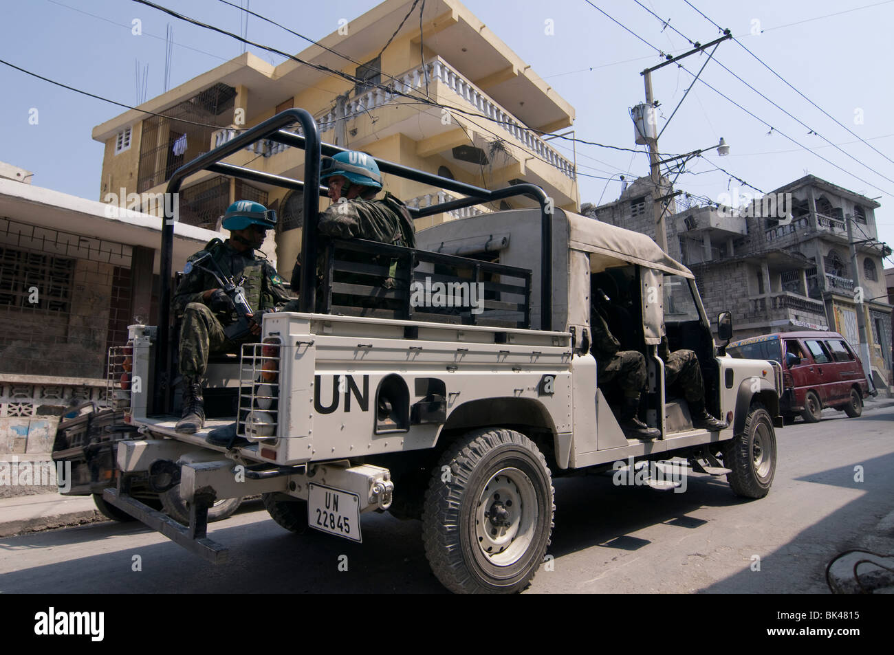 Peacekeeping policemen carrying out The United Nations Stabilization Mission in Haiti (MINUSTAH) riding through the city of Port au Prince in Haiti Stock Photo