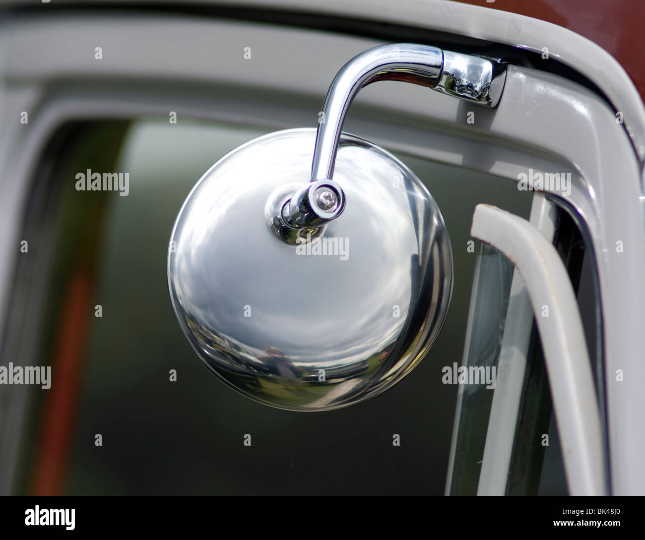 door hung rear view mirror on classic morris minor 1000 car Stock