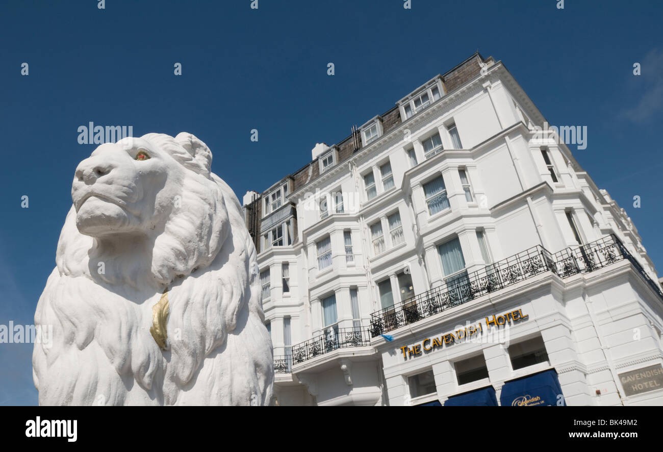 UNITED KINGDOM, ENGLAND, 5th April 2010. The Cavendish Hotel in Eastbourne with a lion from another hotel in the foreground. Stock Photo