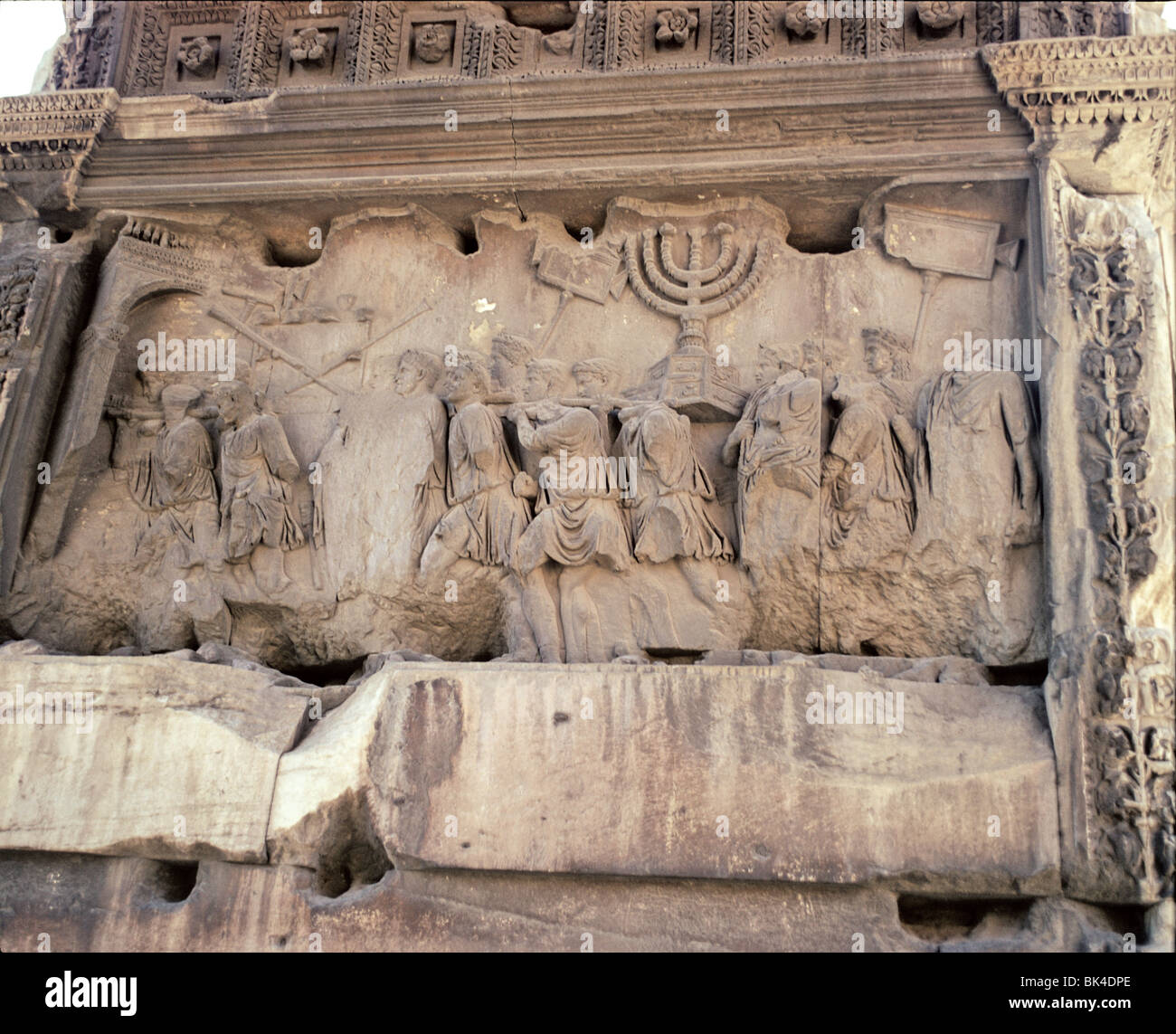 Rome Italy - Sculpture on the Arch of Titus depicting sacking of Jerusalem in year 70 AD by Romans during First Jewish-Roman War Stock Photo