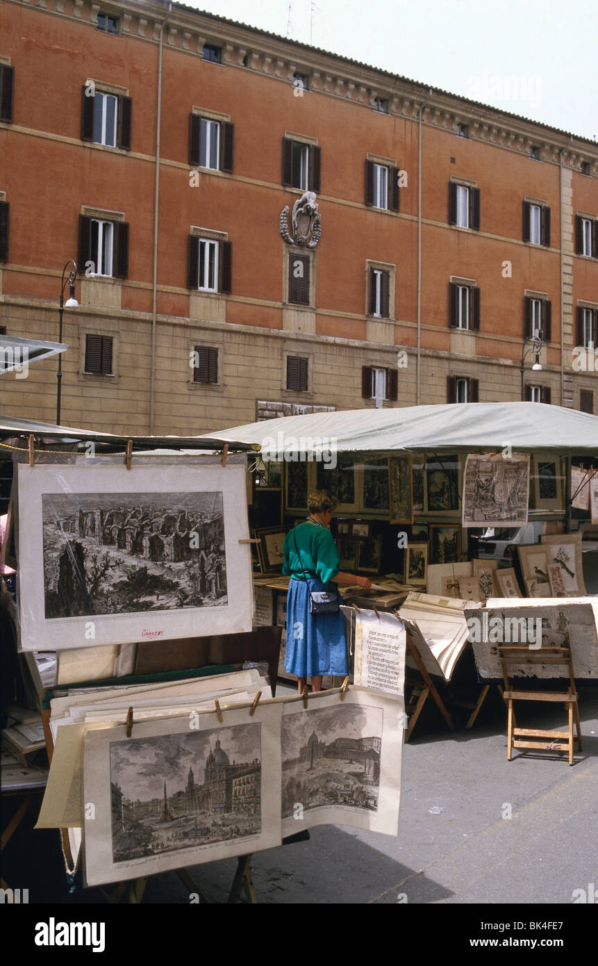Art market stalls and vendors with displays of fine art prints for sale in the Piazza Borghese square, Rome, Italy Stock Photo