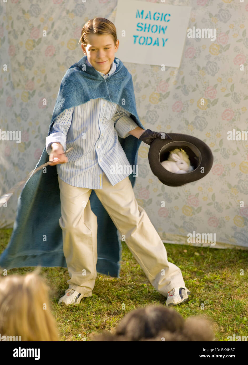 Boy putting on magic show Stock Photo