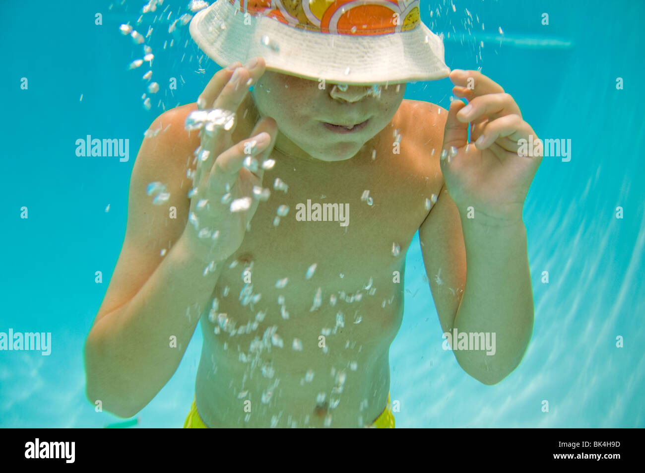Boy holding his breath under water Stock Photo