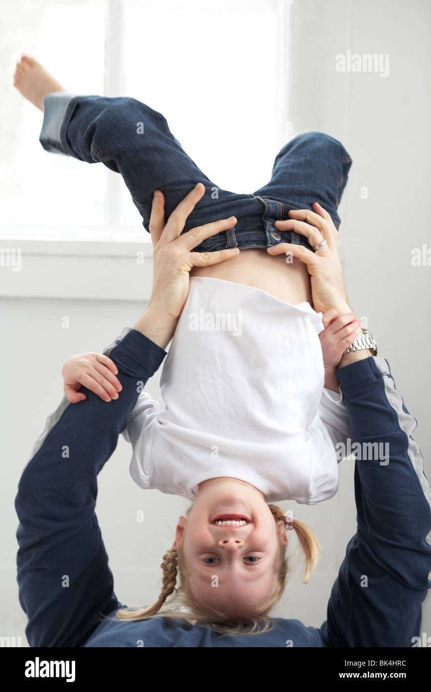 Girl playing with her Dad Stock Photo