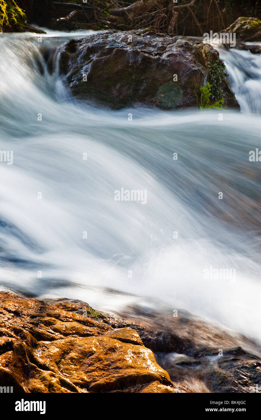 strong current of water in a river flowing Stock Photo