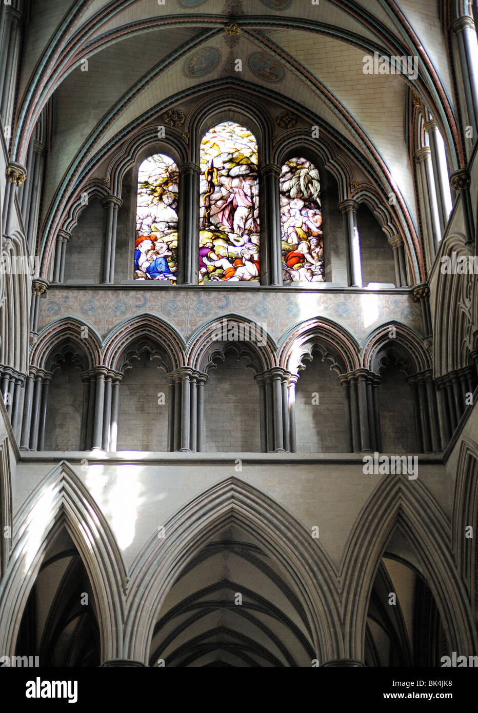 Arches and stained glass windows inside Salisbury Cathedral Stock Photo