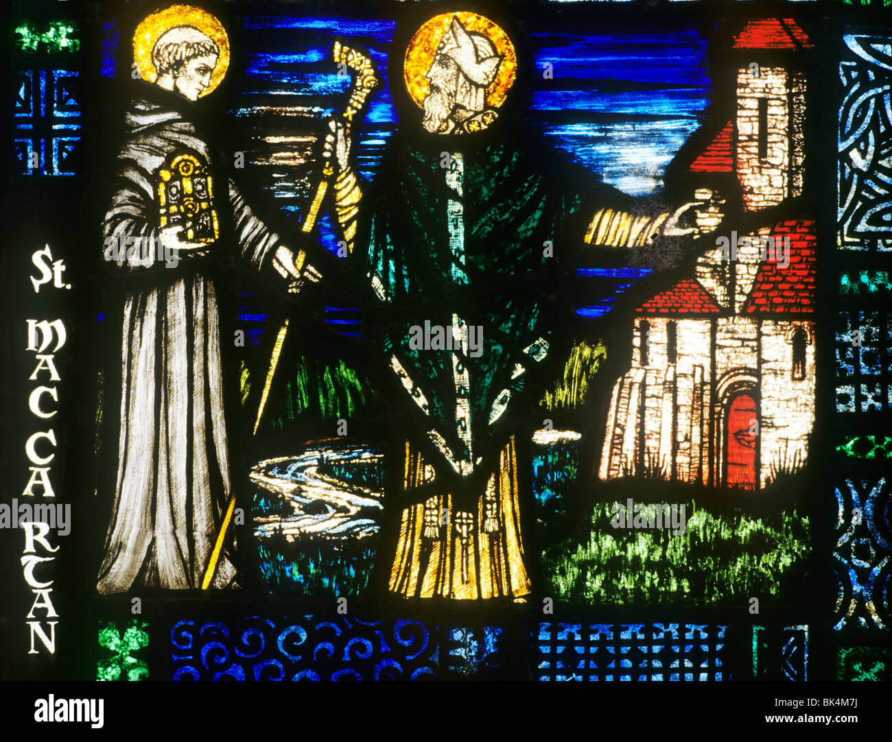 Carrickmacross, County Monaghan, Harry Clarke stained glass, Ireland Saint Maccartan Macartan Eire Irish window windows Stock Photo