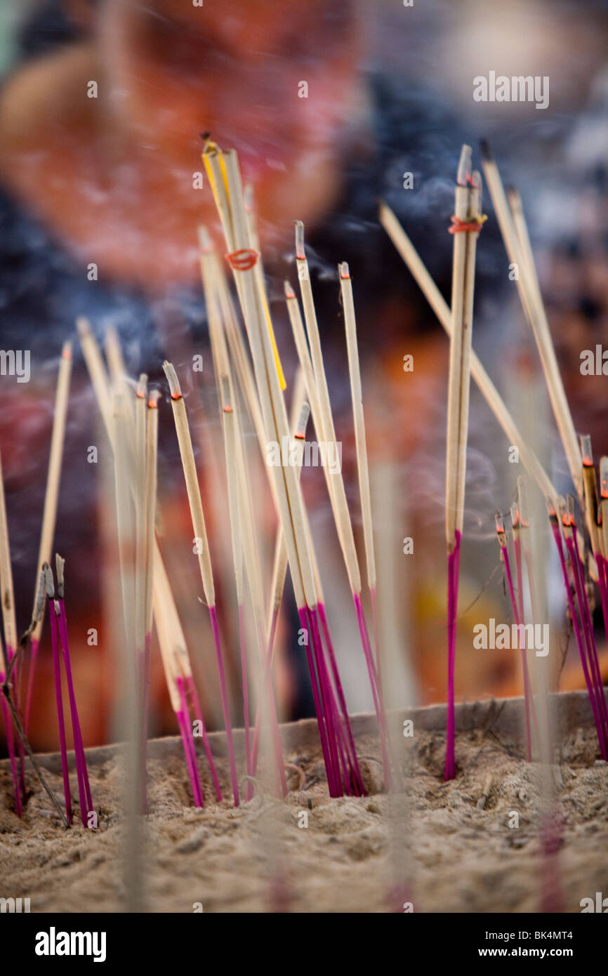 Lighting incense sticks candles temple hi-res stock photography and ...