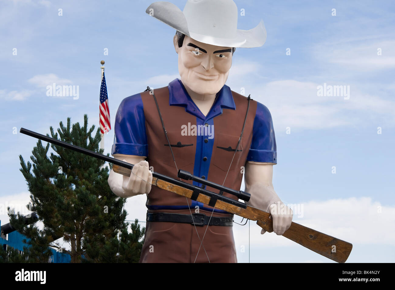 Rockvale, Montana. A giant 20ft Muffler Man aka Big Jim Bridger, toting a rifle with scope, in front of Fort Rockvale Casino. Stock Photo