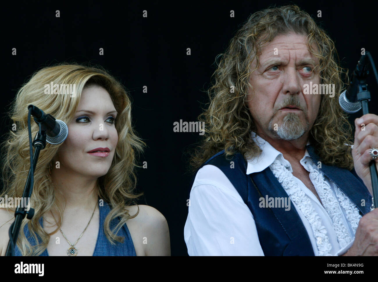 Robert Plant and Alison Krauss perform during a concert. Stock Photo