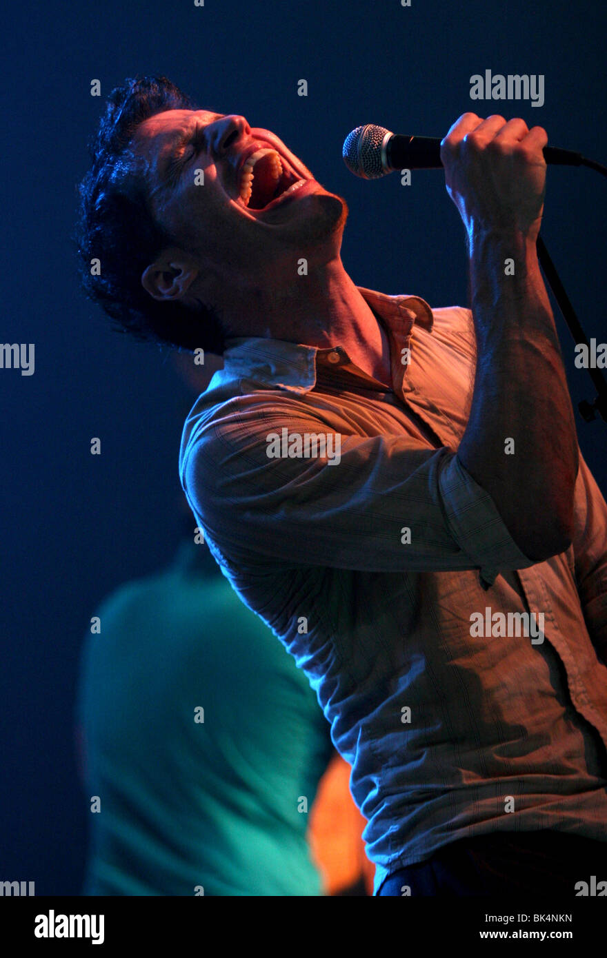 Paul Meany of Mute Math performs during a concert. Stock Photo