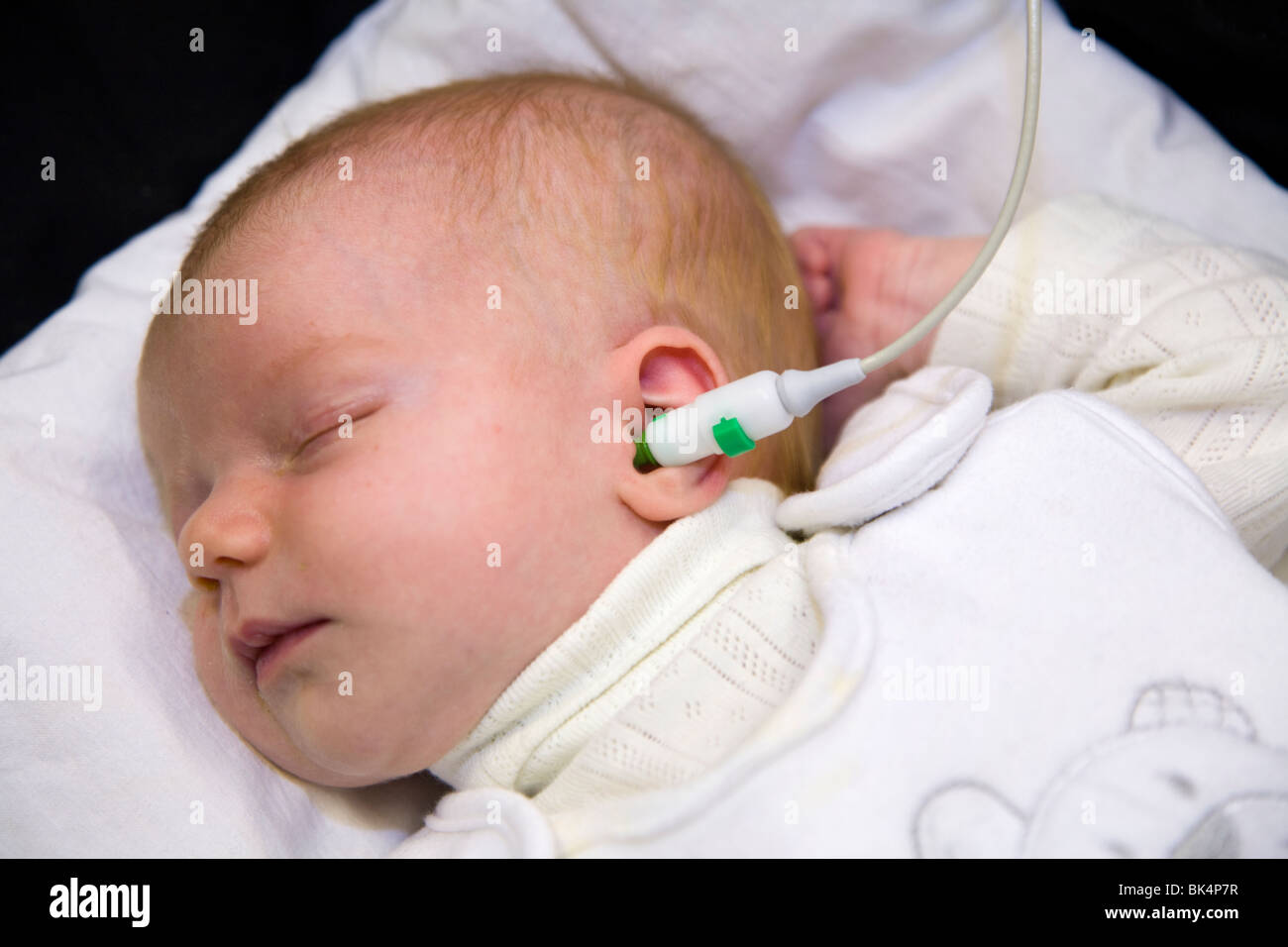 Newborn / new born baby undergoes a routine neonatal hearing screening