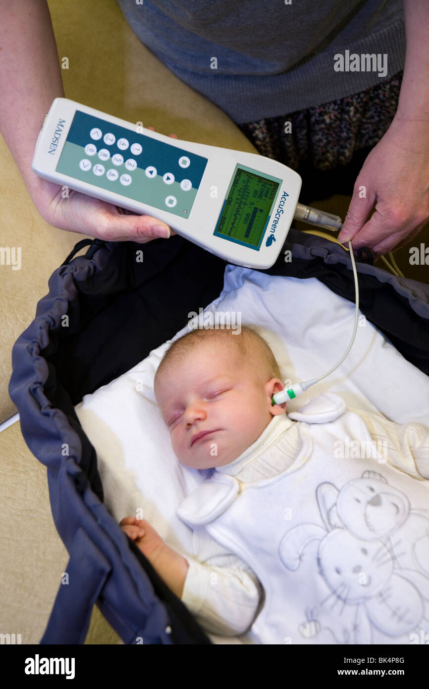 Newborn / new born baby undergoes a routine neonatal hearing screening