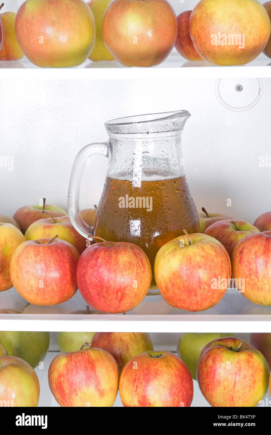 apples with jug in the refrigerator Stock Photo Alamy
