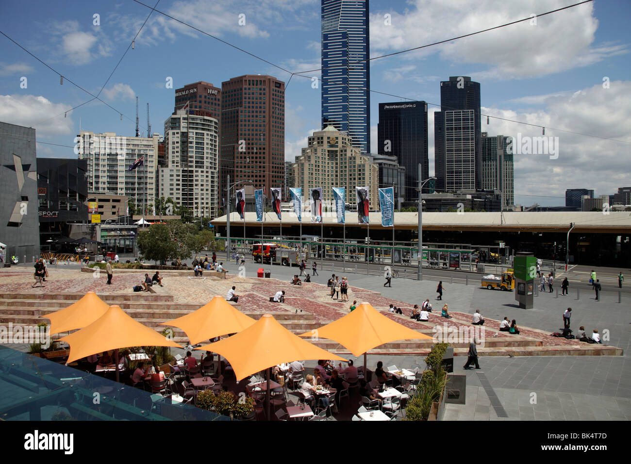 street cafe on Federation Square and the Melbourne Skyline, Victoria, Australia Stock Photo
