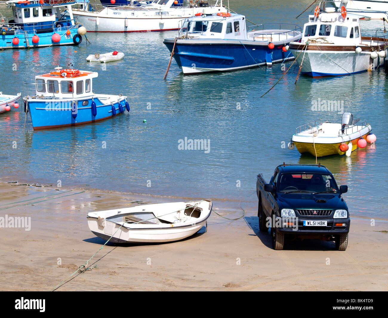 Mitsubishi pick up truck on the sand at Newquay harbour, Cornwall Stock