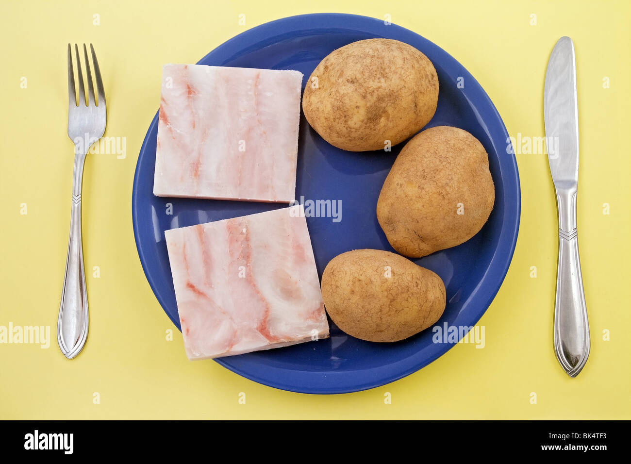 fish fillet and potatoes in jackets Stock Photo Alamy