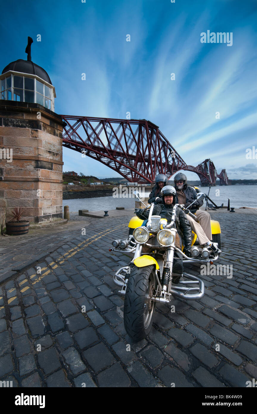The Forth Rail Bridge and a Trike from Trike Tours Scotland, North Queensferry. Stock Photo