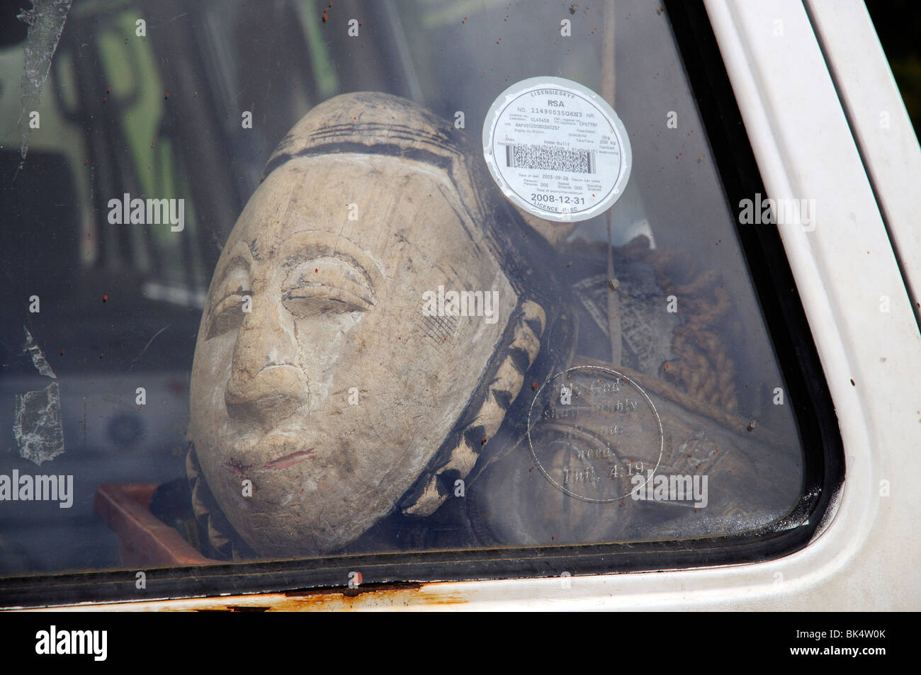 African tribal mask in a car Stock Photo