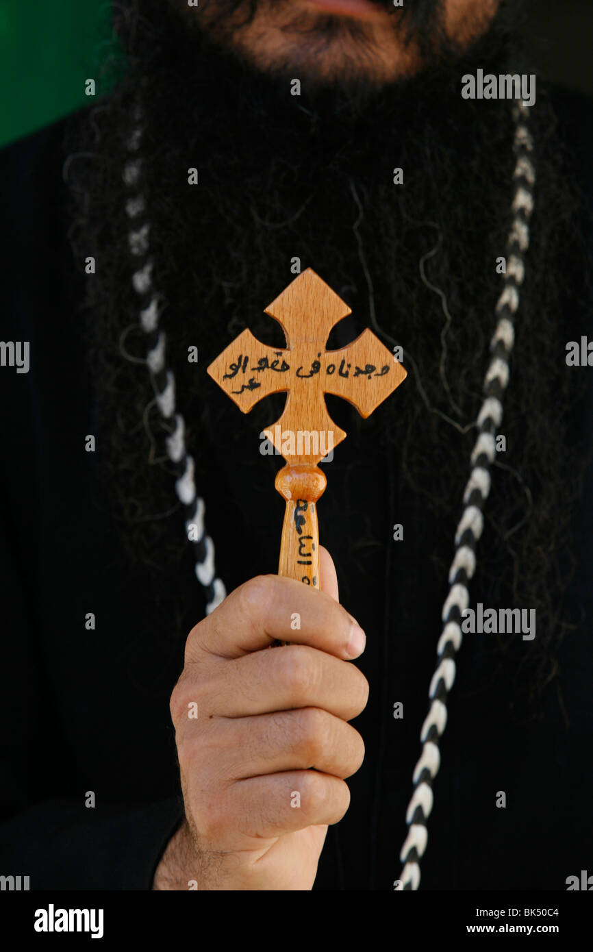Egyptian Orthodox Coptic priest showing cross, Jerusalem, Israel, Middle East Stock Photo