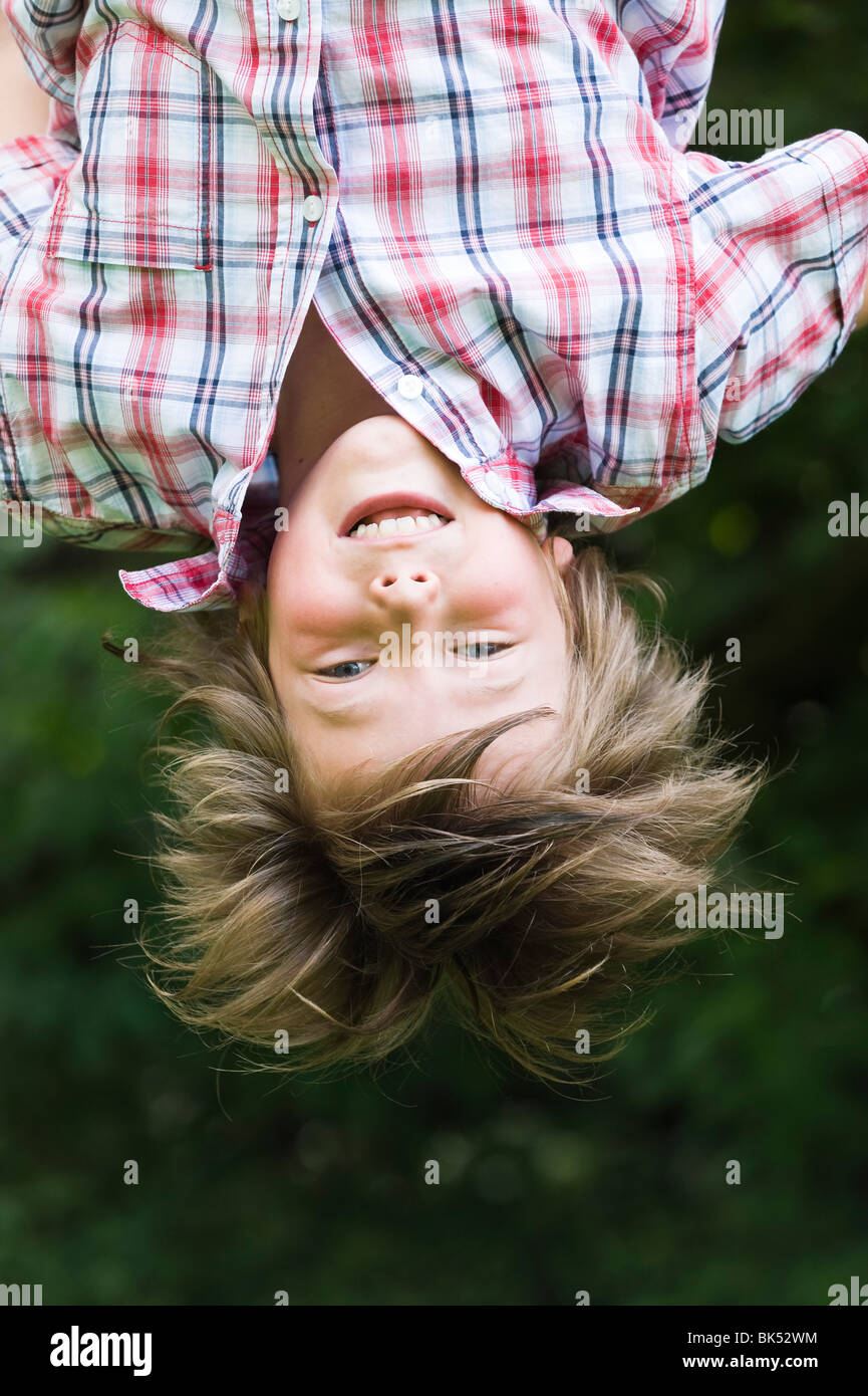 Boy Hanging Upside Down Stock Photo Alamy