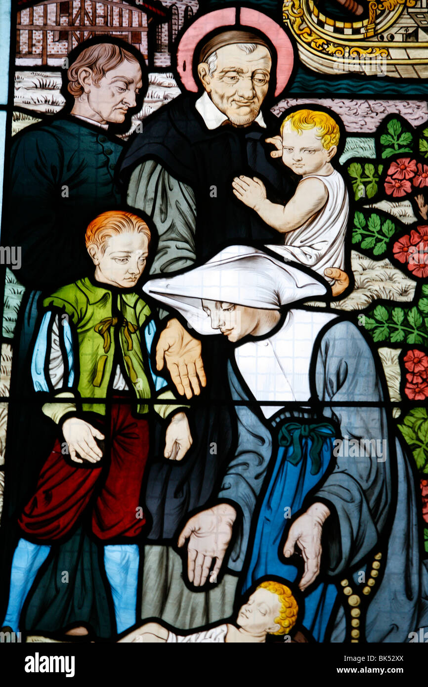 Stained glass depicting St. Vincent de Paul, at Saint-Honorﾎ d'Eylau church, Paris, France Stock Photo