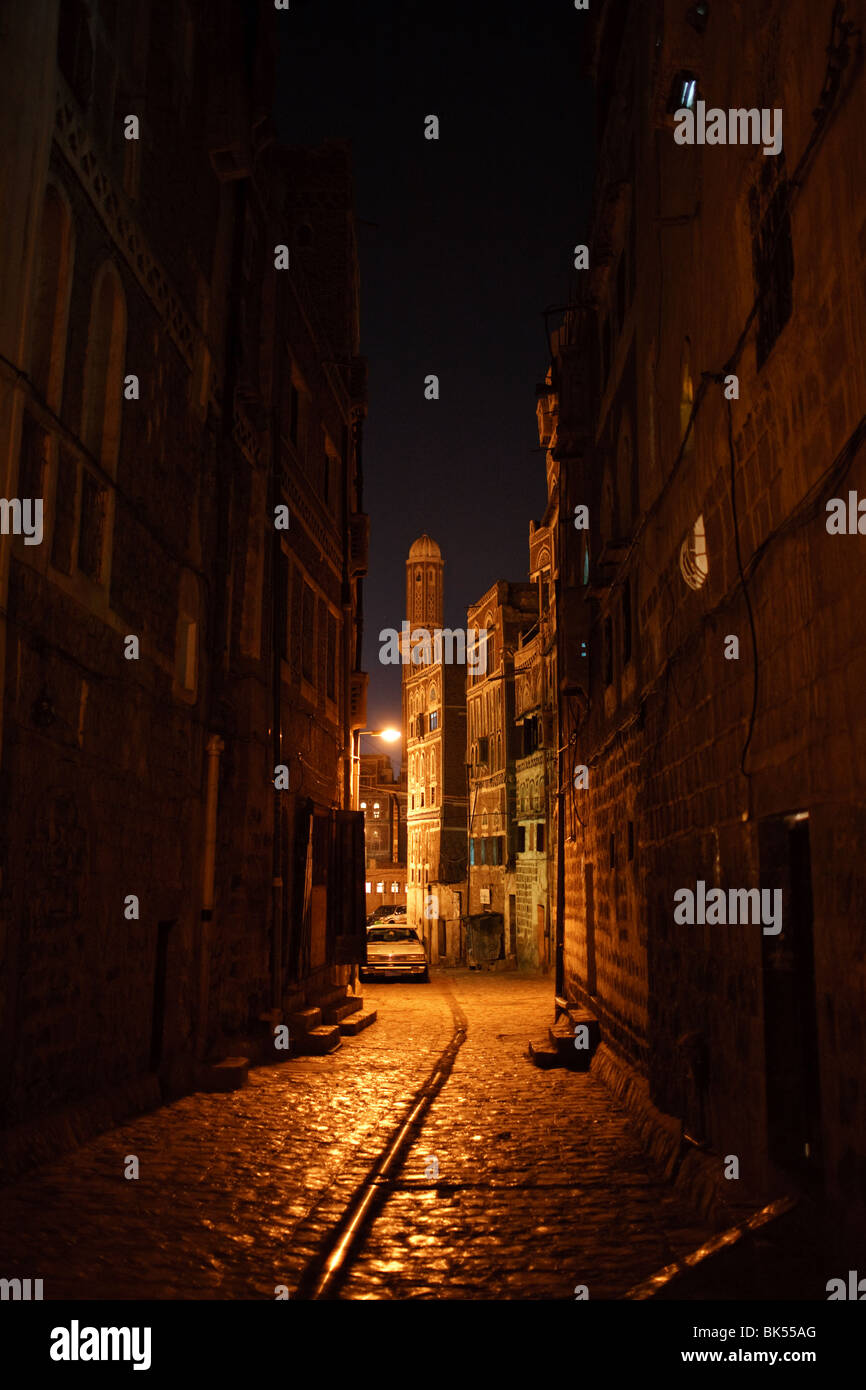 an old cobbled street at night in the Old City of Sana'a, Yemen Stock Photo