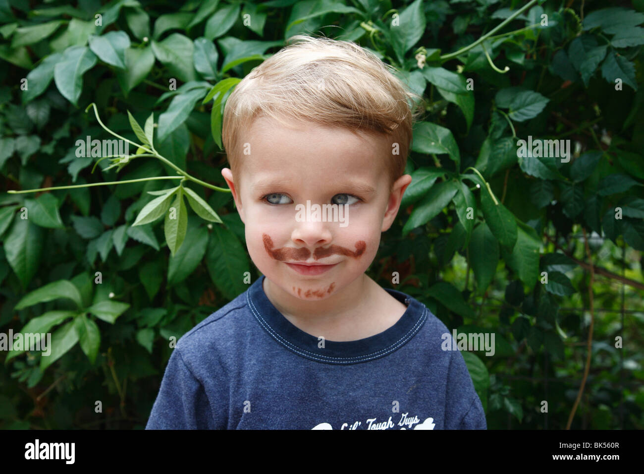 Portrait of Little Boy With Fake Moustache Stock Photo