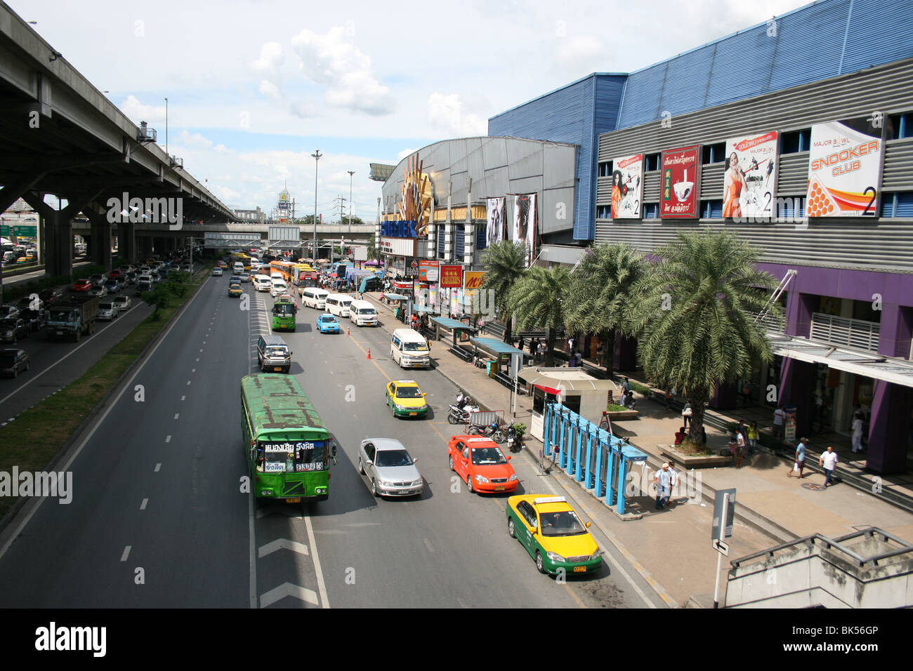 Taxis waits for customers next to a cinema in Bangkok, Thailand. Stock Photo
