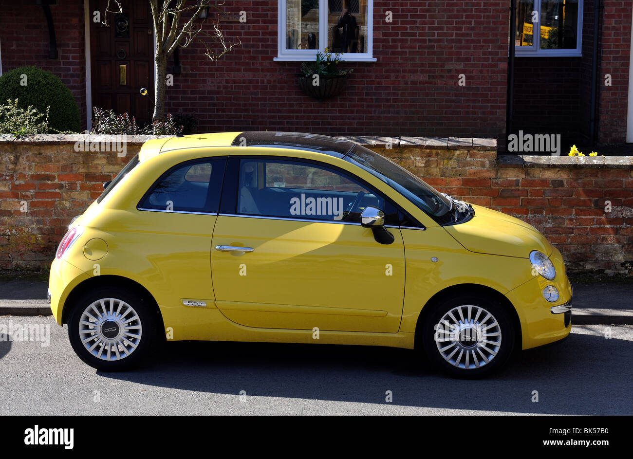 A yellow Fiat 500 car Stock Photo