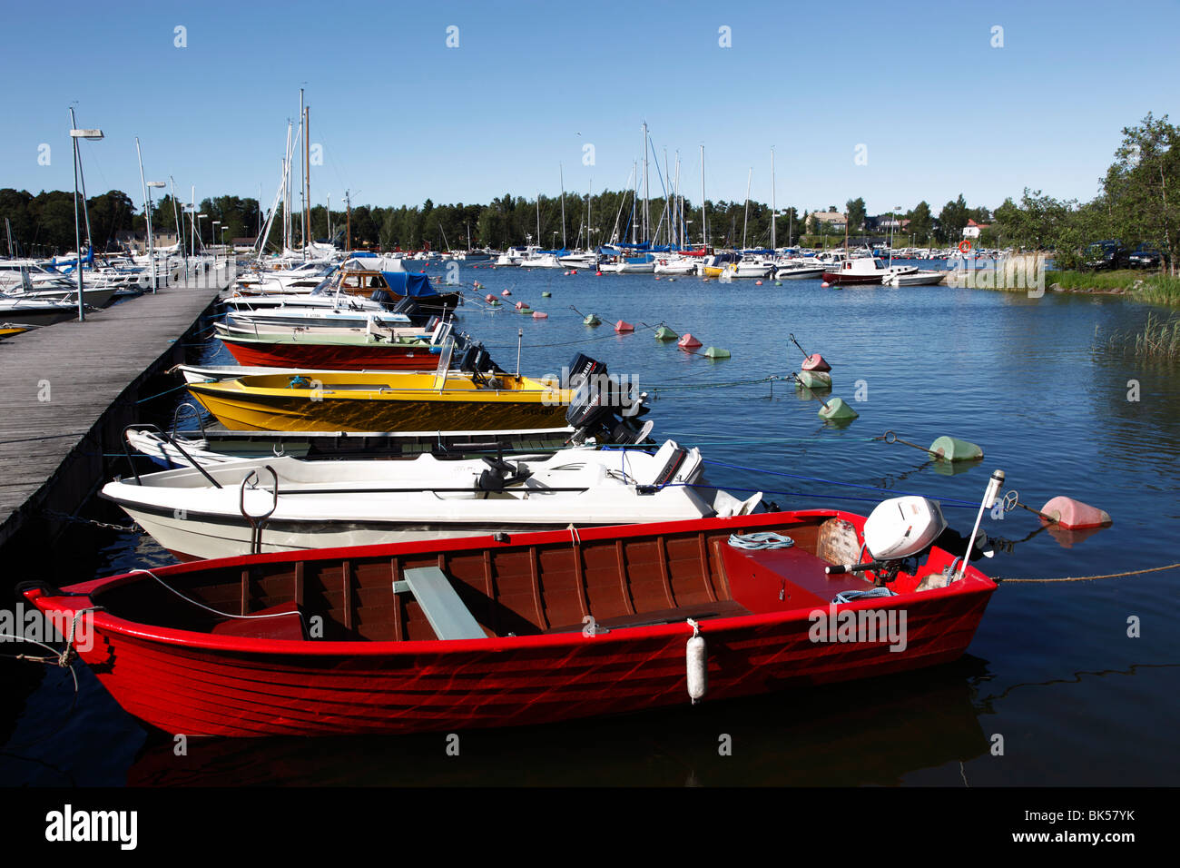 Motor boats moored at jetty in the marina, Syaraumanlahti Bay, Gulf of Bothnia, Rauma, Satakunta, Finland, Scandinavia, Europe Stock Photo