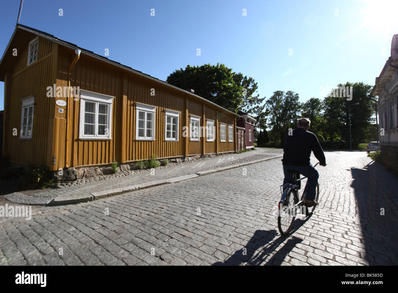 Cyclist on cobblestone street, Old Town, Rauma, Satakunta, Finland, Scandinavia, Europe Stock Photo