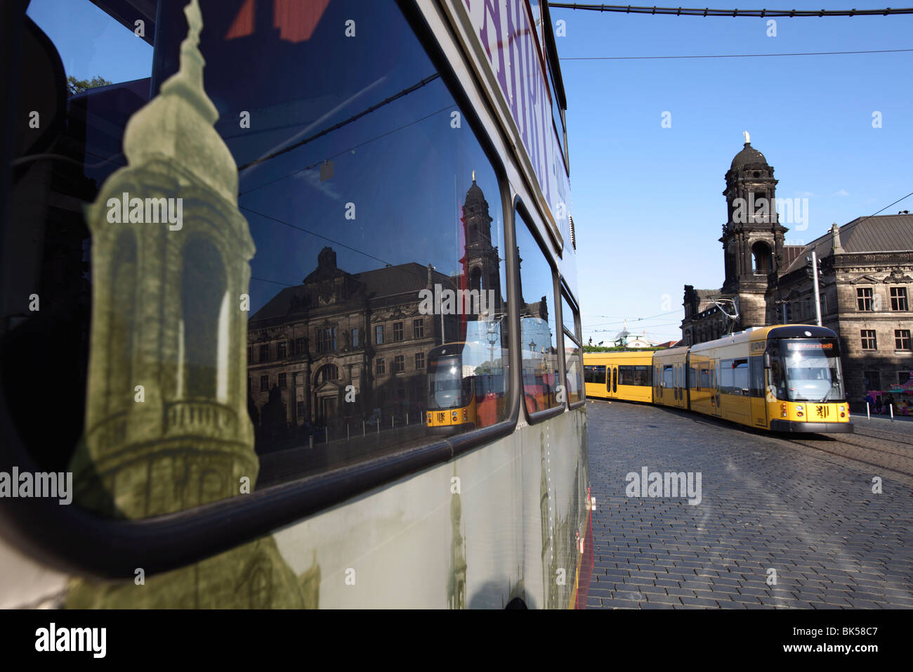 Reflection in bus window, tram on street and Neues Standehaus (New State House), Schlossplatz, Dresden, Saxony, Germany, Europe Stock Photo