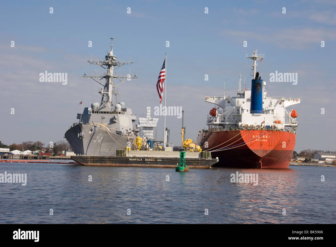Ships in overhaul on the Elizabeth River in Virginia are the USS FORREST SHERMAN DDG-98 and the BIG SKY registered in Panama Stock Photo