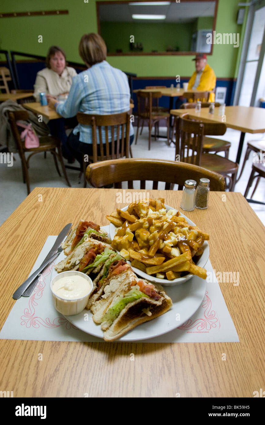 Poutine in a restaurant in Quebec City Canada Stock Photo