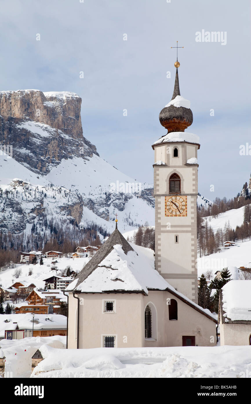 The church and village of Colfosco in Badia and Sella Massif range of mountains, South Tirol, Trentino-Alto Adige, Italy Stock Photo
