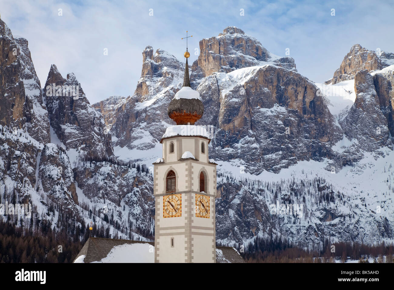 The church and village of Colfosco in Badia and Sella Massif range of mountains, South Tirol, Trentino-Alto Adige, Italy Stock Photo