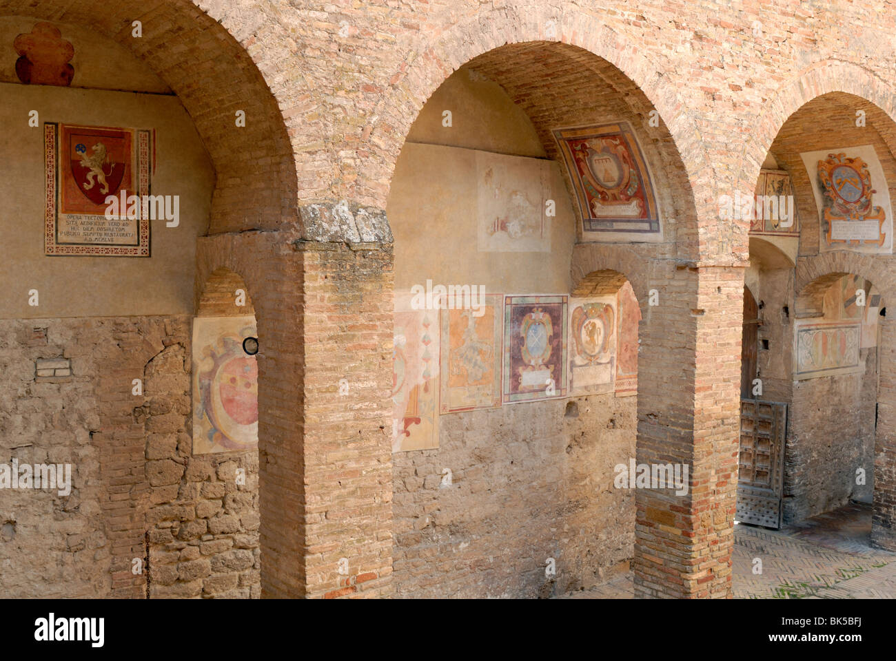 The Worn Frescoes Of The Coats Of Arms Of City Mayors And Magistrates In The Courtyard Of The