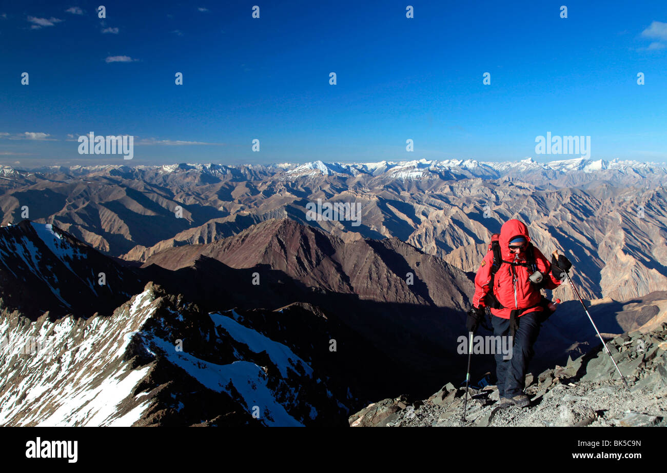 A climber makes her way up the summit ridge of Stok Kangri in the northern Zanskar Range, Ladakh, India Stock Photo