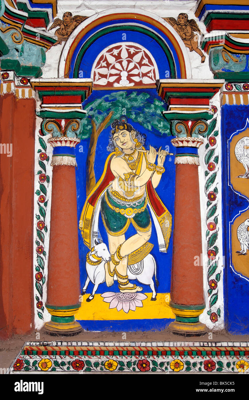 Lord Venugopala (Krishna). 150 year old Mural (vegetable dye) and stucco work on the interior wall of the temple choultry at Stock Photo
