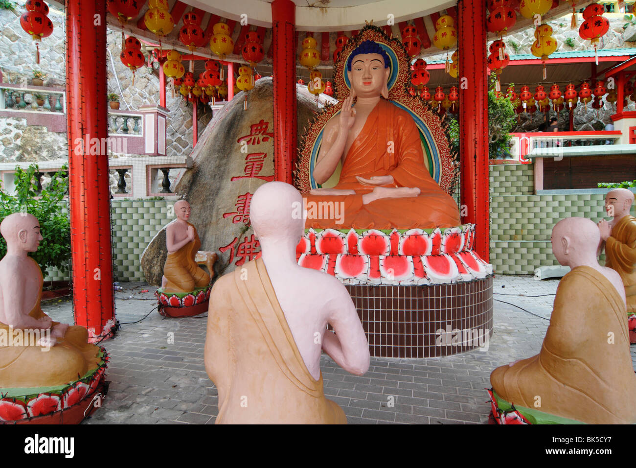 Statue of Buddha and disciples at Kek Lok Si Temple in Penang, Malaysia ...