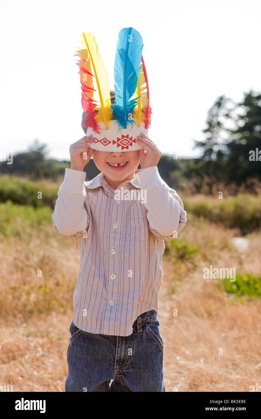 Young boy wearing indian feathers Stock Photo Alamy