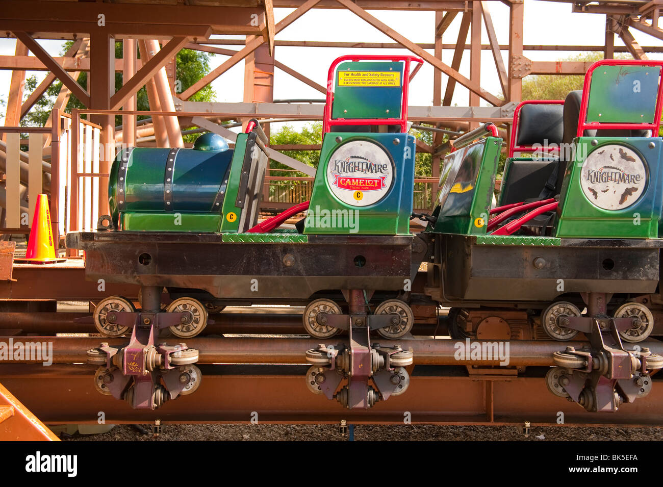 Roller coaster cars and train wheels on tracks Stock Photo