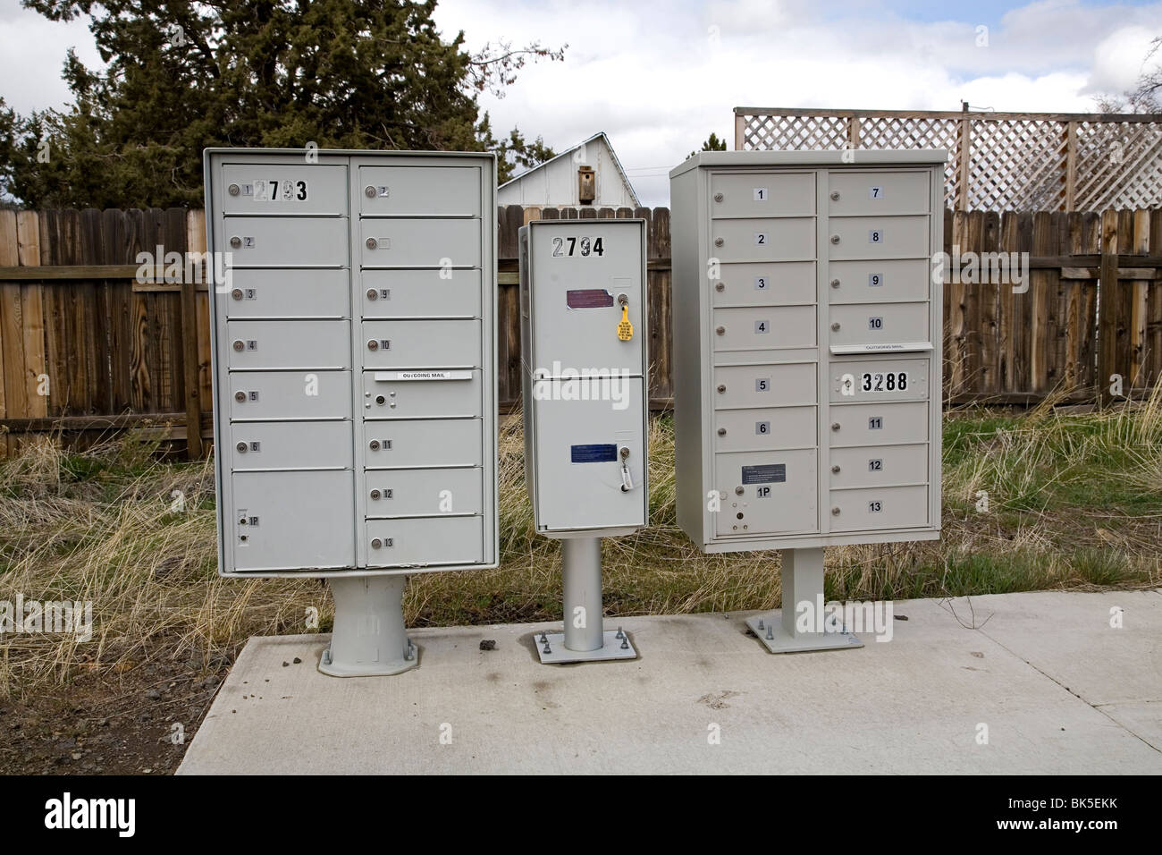 Locked and armored mailboxes in a residential street in an American city Stock Photo