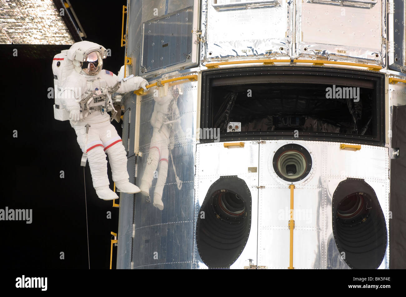 Astronaut performs work on the Hubble Space Telescope Stock Photo