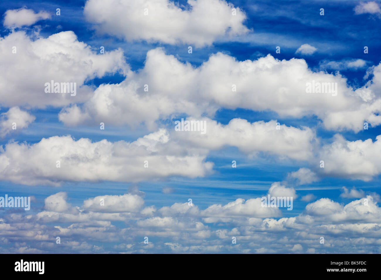 blue sky with white fluffy clouds background Stock Photo - Alamy